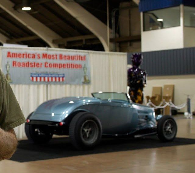 Blue Ribbon, the baby-blue scalloped '32 highboy, beneath the America's Most Beautiful Roadster competition banner