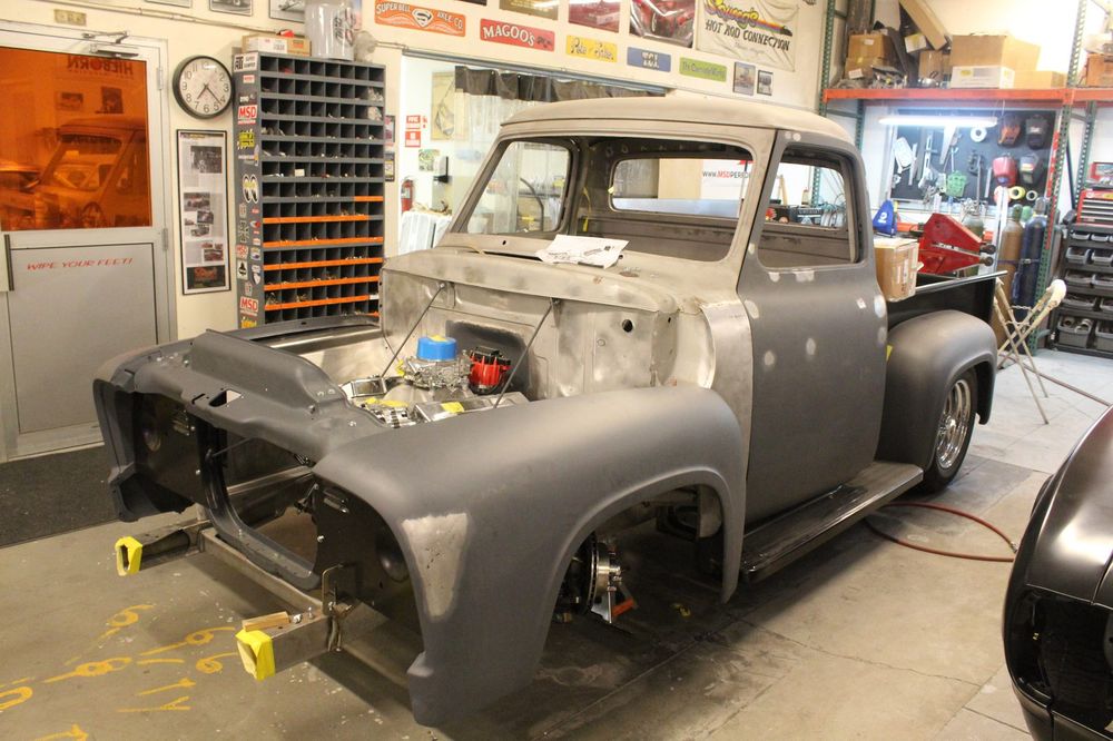 A bare-metal pickup cab under fabrication on the Squeeg’s shop floor