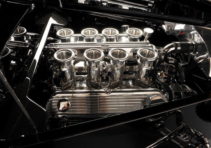 Induction detail on the '33 Woodie's Roush V8, individual stacks in black and white