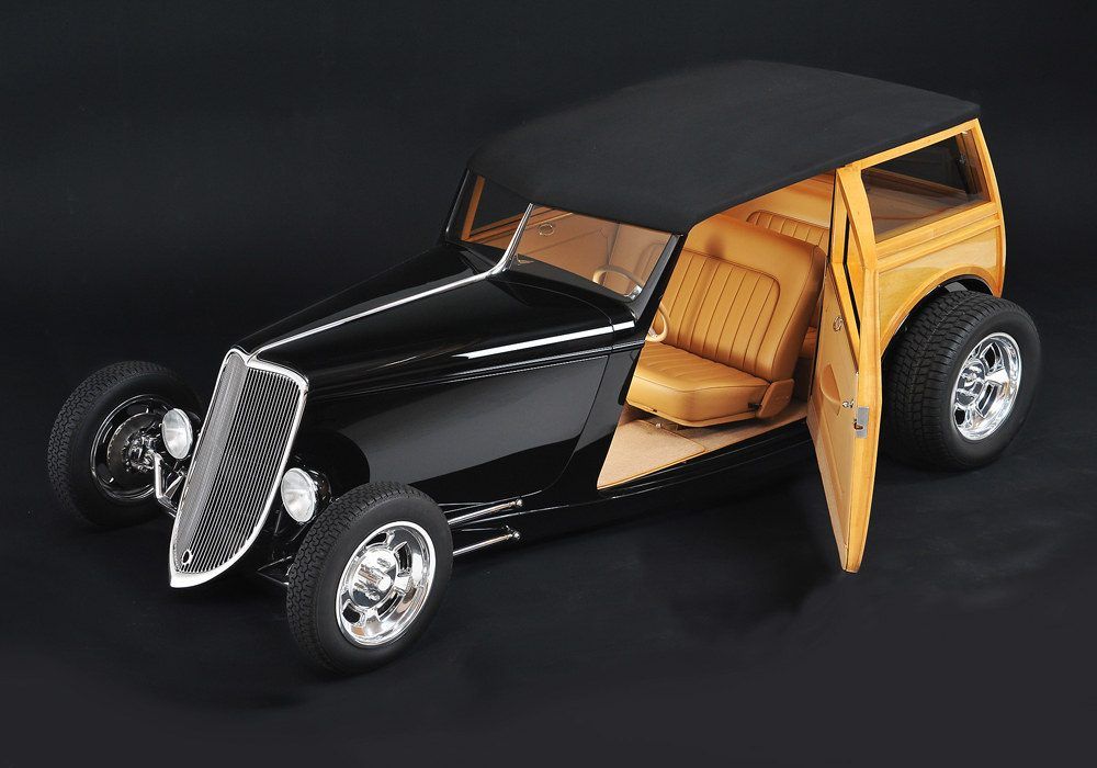 Studio shot of the ground-up, Roush-powered custom '33 Woodie — black over natural wood
